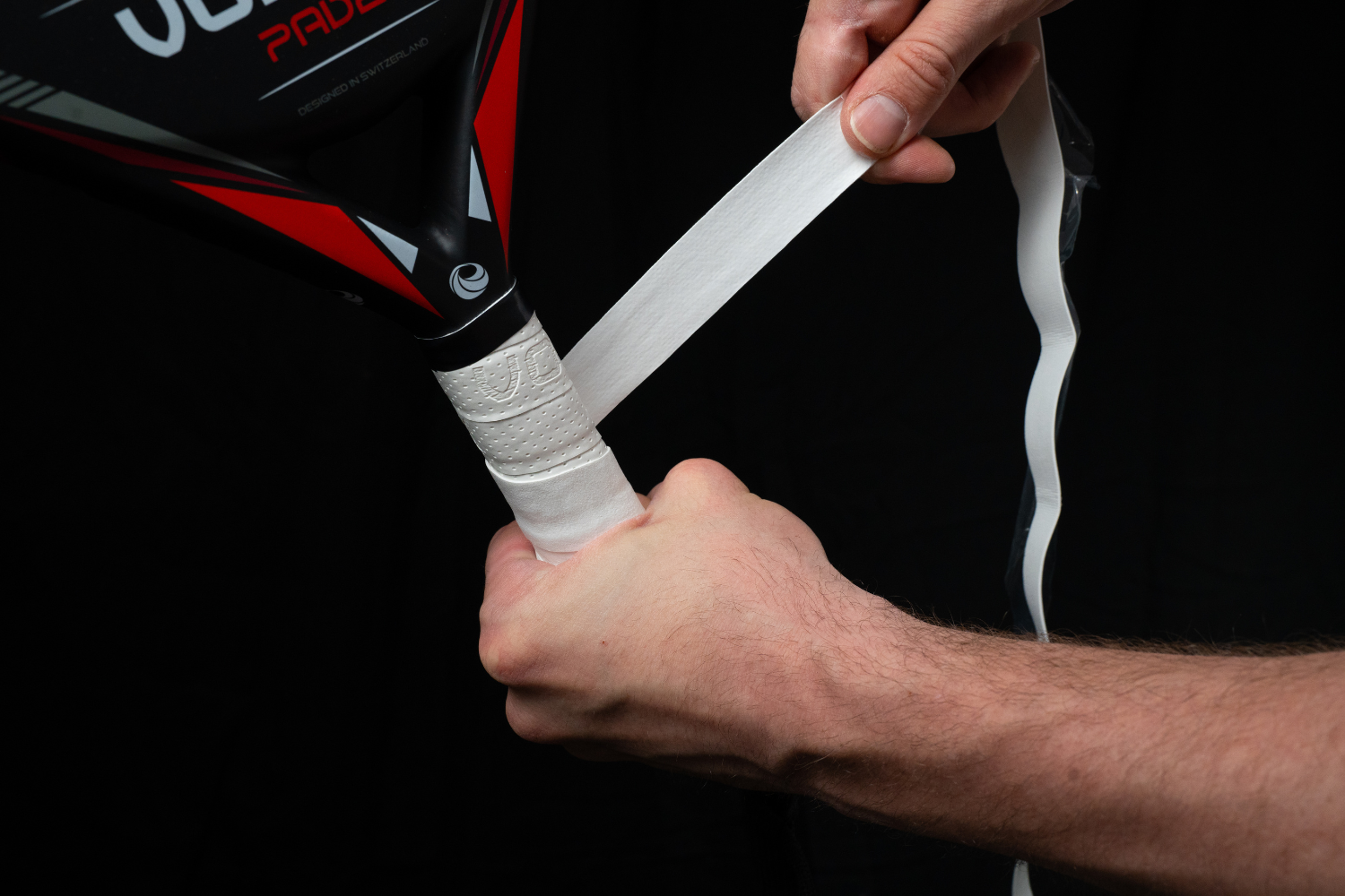 Photo d'un joueur qui met un grip